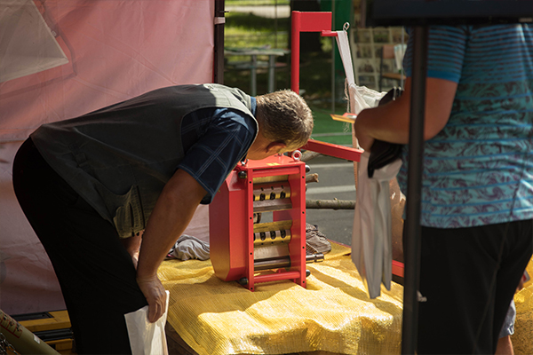 Visitor to the exhibition examines the structure of wood chippers